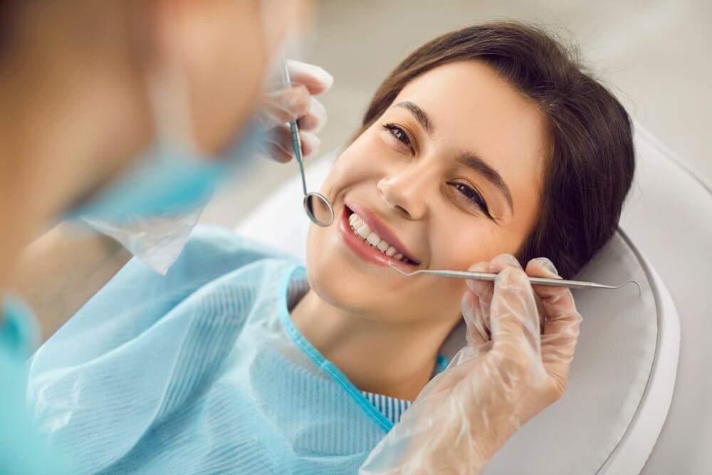 A Tony Hill Dental dentist doing a dental checkup on patient
